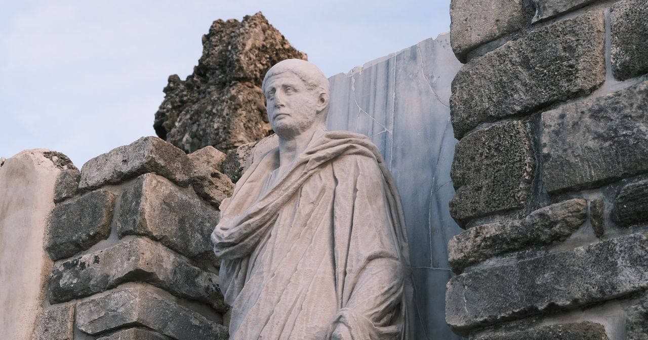 A statue of an ancient Roman orator, a master of persuasion.